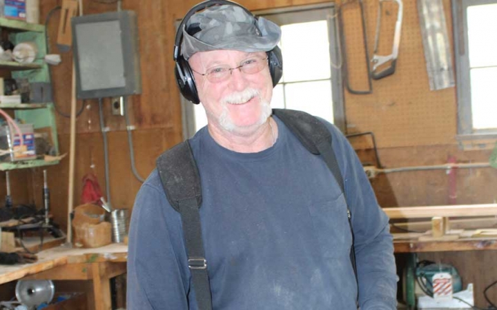A person wearing ear protection during a service project with Outward Bound.